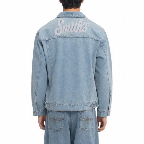 A male model wearing the Smith's 1906 MJK01 Light Blue Denim Jacket is showing the back.