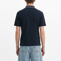 A male model wearing the Smith's 1906 MPO01 Navy Polo is showing the back.