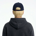 A male model wearing the Smith's 1906 UCP01 Navy Cap is showing the back.