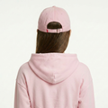A female model wearing the Smith's 1906 UCP02 Pink Cap is showing the back.