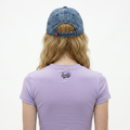 A female model wearing the Smith's 1906 UCP04 Blue Cap is showing the back.