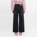 A female model wearing the Smith's 1906 WJN01 Black Jeans is showing the back.