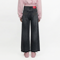 A female model wearing the Smith's 1906 WJN01 Dark Grey Jeans is showing the back.