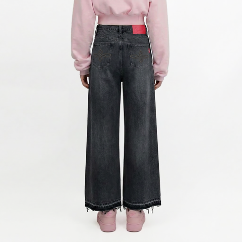 A female model wearing the Smith's 1906 WJN01 Dark Grey Jeans is showing the back.