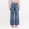 A female model wearing the Smith's 1906 WJN01 Light Blue Jeans is showing the back.