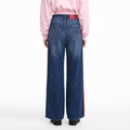 A female model wearing the Smith's 1906 WJN02 Blue Jeans is showing the back.