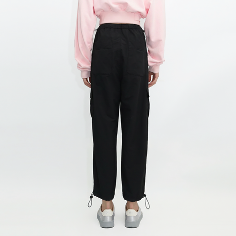 A female model wearing the Smith's 1906 WPT01 Black Pants is showing the back.