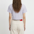 A female model wearing the Smith's 1906 WTE01 Lilac T-shirt is showing the back.