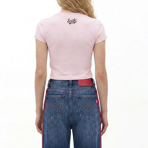 A female model wearing the Smith's 1906 WTE04 Pink T-Shirt is showing the back.