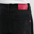 A close-up back view of a male model wearing the Smith's 1906 MJN01 Black Jeans.