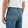 A close-up back view of a male model wearing the Smith's 1906 MJN03 Blue Jeans.