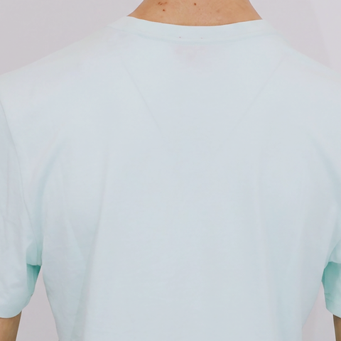 A close-up back view of a male model wearing the Smith's 1906 MTE02 Blue T-Shirt.