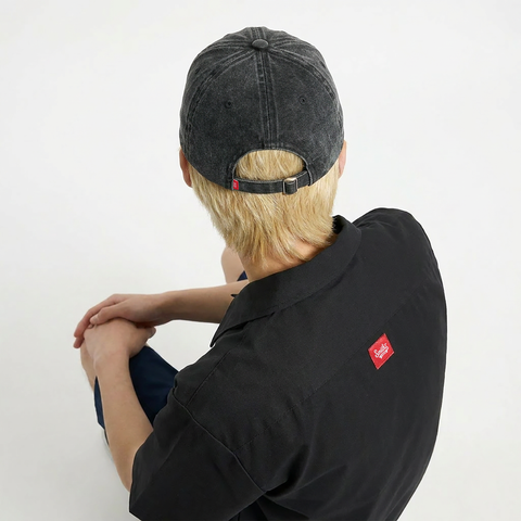 A close-up back view of a male model wearing the Smith's 1906 UCP04 Gray Cap.