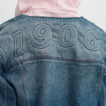 A close-up back view of a female model wearing the Smith's 1906 WJK02 Dark Blue Denim Jacket.