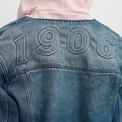 A close-up back view of a female model wearing the Smith's 1906 WJK02 Dark Blue Denim Jacket.