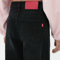 A close-up back view of a female model wearing the Smith's 1906 WJN01 Black Jeans.