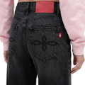 A close-up back view of a female model wearing the Smith's 1906 WJN01 Dark Grey Jeans.