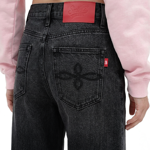 A close-up back view of a female model wearing the Smith's 1906 WJN01 Dark Grey Jeans.