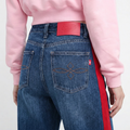 A close-up back view of a female model wearing the Smith's 1906 WJN02 Blue Jeans.