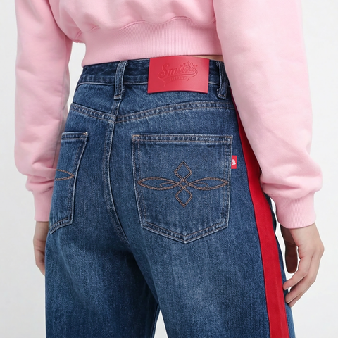 A close-up back view of a female model wearing the Smith's 1906 WJN02 Blue Jeans.