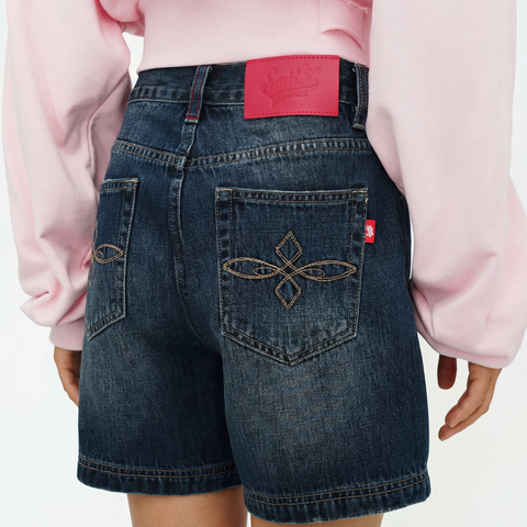 A close-up back view of a female model wearing the Smith's 1906 WSO01 Blue Denim Shorts.