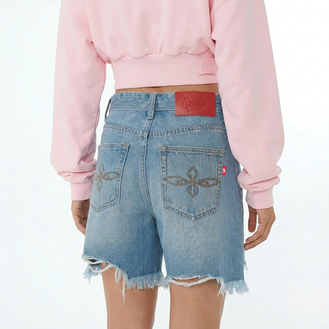 A close-up back view of a female model wearing the Smith's 1906 WSO02 Light Blue Denim Shorts.