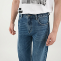 A close-up view of a male model wearing the Smith's 1906 MJN03 Blue Jeans.