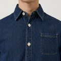 A close-up view of a male model wearing the Smith's 1906 MSR04 Navy Denim Short-Sleeve Shirt.