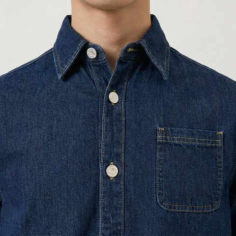 A close-up view of a male model wearing the Smith's 1906 MSR04 Navy Denim Short-Sleeve Shirt.