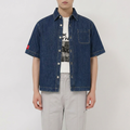 A close-up view of a male model wearing the Smith's 1906 MSR04 Navy Denim Short-Sleeve Shirt.
