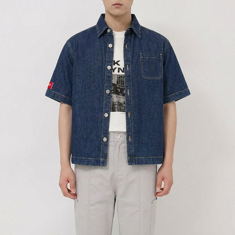 A close-up view of a male model wearing the Smith's 1906 MSR04 Navy Denim Short-Sleeve Shirt.