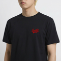 A close-up view of a male model wearing the Smith's 1906 MTE01 Black T-Shirt.