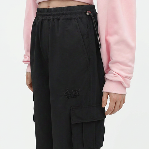 A close-up view of a female model wearing the Smith's 1906 WPT01 Black Pants.