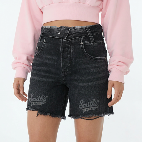 A close-up view of a female model wearing the Smith's 1906 WSO02 Dark Grey Denim Shorts.