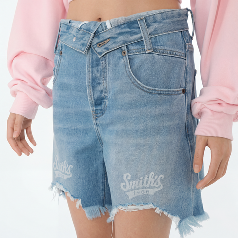 A close-up view of a female model wearing the Smith's 1906 WSO02 Light Blue Denim Shorts.