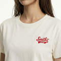 A close-up view of a female model wearing the Smith's 1906 WTE01 Beige T-shirt.
