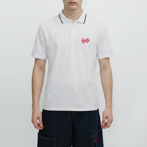 A male model wearing the Smith's 1906 MPO01 White Polo is showing the front.