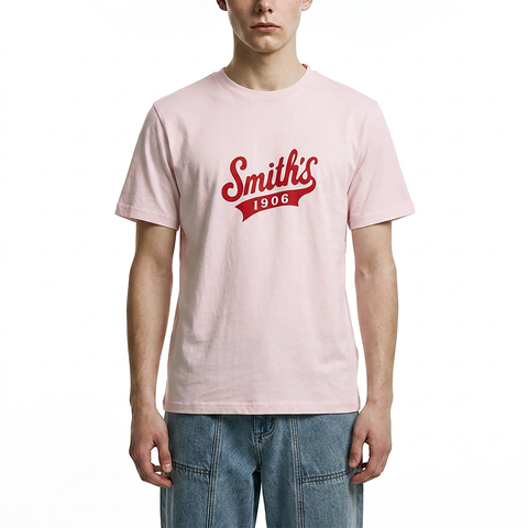 A male model wearing the Smith's 1906 MTE02 Pink T-Shirt is showing the front.