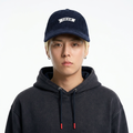 A male model wearing the Smith's 1906 UCP01 Navy Cap is showing the front.