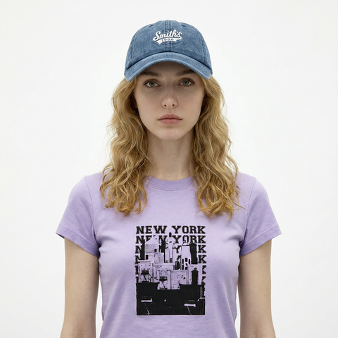 A female model wearing the Smith's 1906 UCP04 Blue Cap is showing the front.
