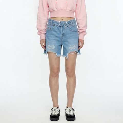 A female model wearing the Smith's 1906 WSO02 Light Blue Denim Shorts is showing the front.