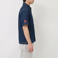 A male model wearing the Smith's 1906 MSR04 Navy Denim Short-Sleeve Shirt is showing the side view.