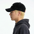 A male model wearing the Smith's 1906 UCP01 Black Cap is showing the side view.