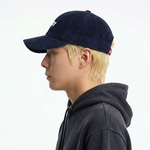 A male model wearing the Smith's 1906 UCP01 Navy Cap is showing the side view.