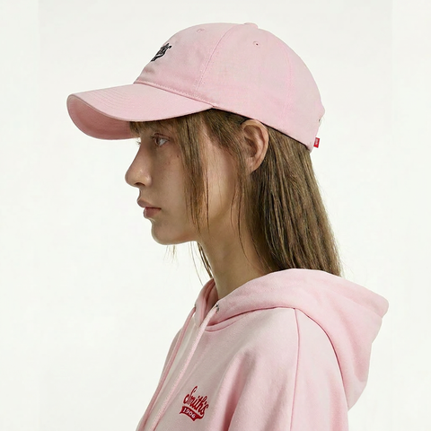 A female model wearing the Smith's 1906 UCP02 Pink Cap is showing the side view.