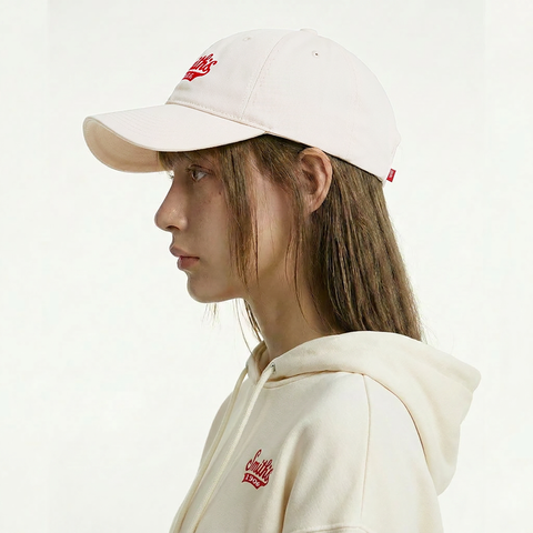 A female model wearing the Smith's 1906 UCP02 White Cap is showing the side view.