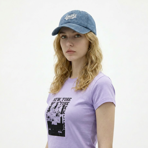 A female model wearing the Smith's 1906 UCP04 Blue Cap is showing the side view.