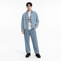 A male model is wearing a pair of jeans paired with the Smith's 1906 MJK01 Light Blue Denim Jacket.