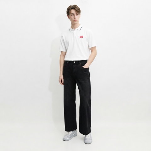 A male model is wearing a polo shirt paired with the Smith's 1906 MJN01 Black Jeans.