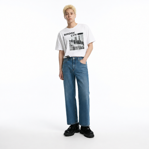 A male model is wearing a T-shirt paired with the Smith's 1906 MJN03 Blue Jeans.